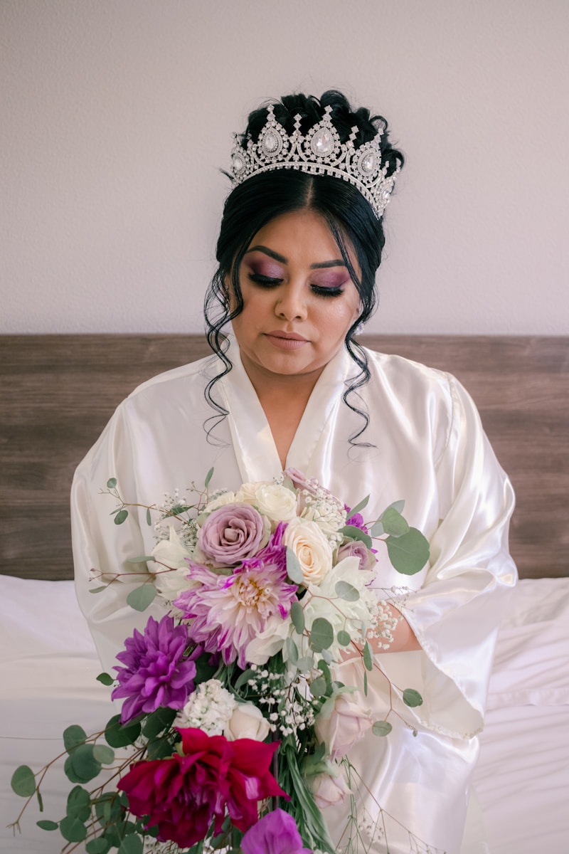 a woman wearing a crown and holding flowers